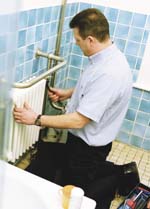 image of a engineer who is installing the heating system