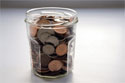 Image of a jar of coins showing the savings made