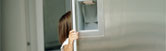 image of a child opening a fridge