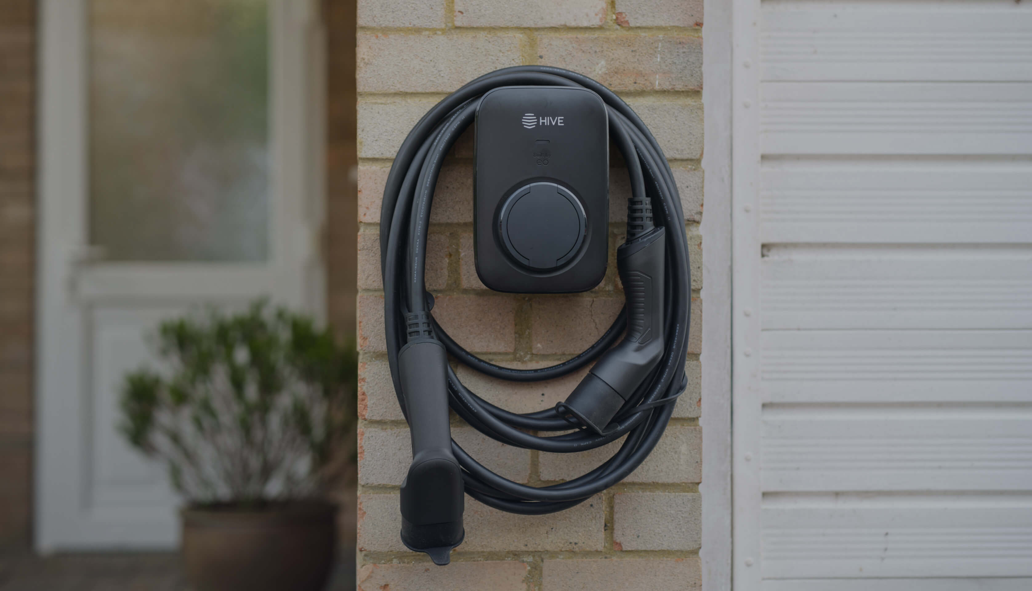 A Hive EO Mini Pro 3 EV charger installed outside a home.