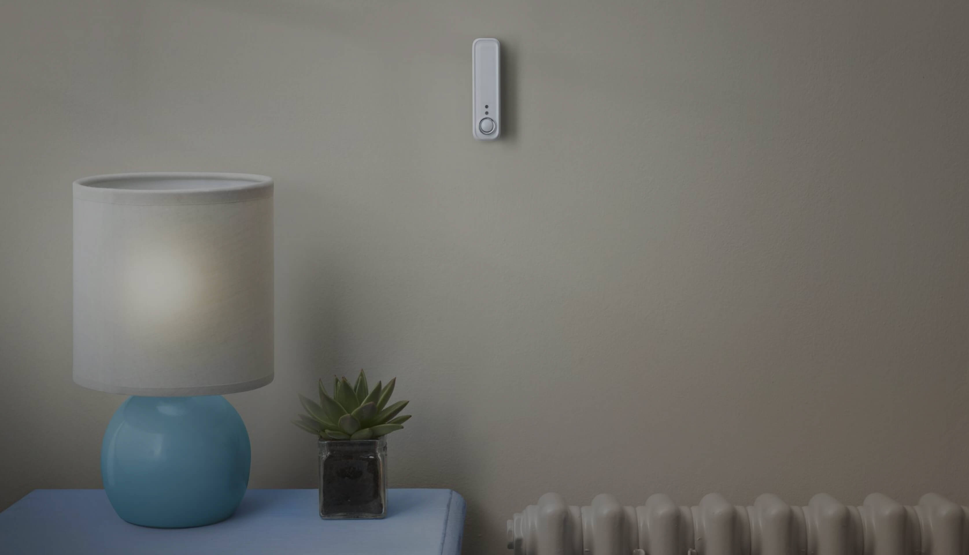 The Hive Smart Motion Sensor inside a living room fixed on the wall.