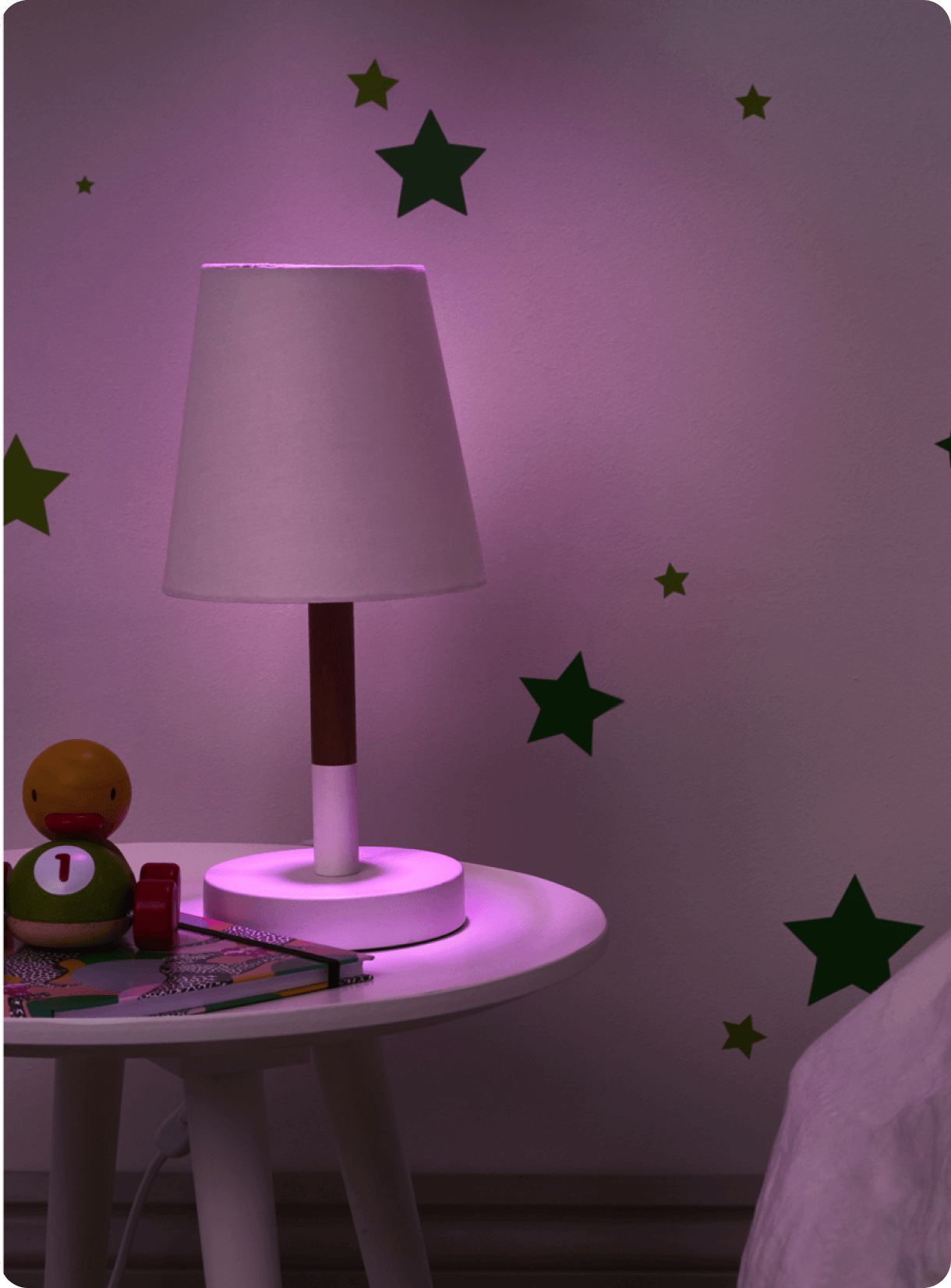 A Multicolour Hive Home smart light in a child's bedroom