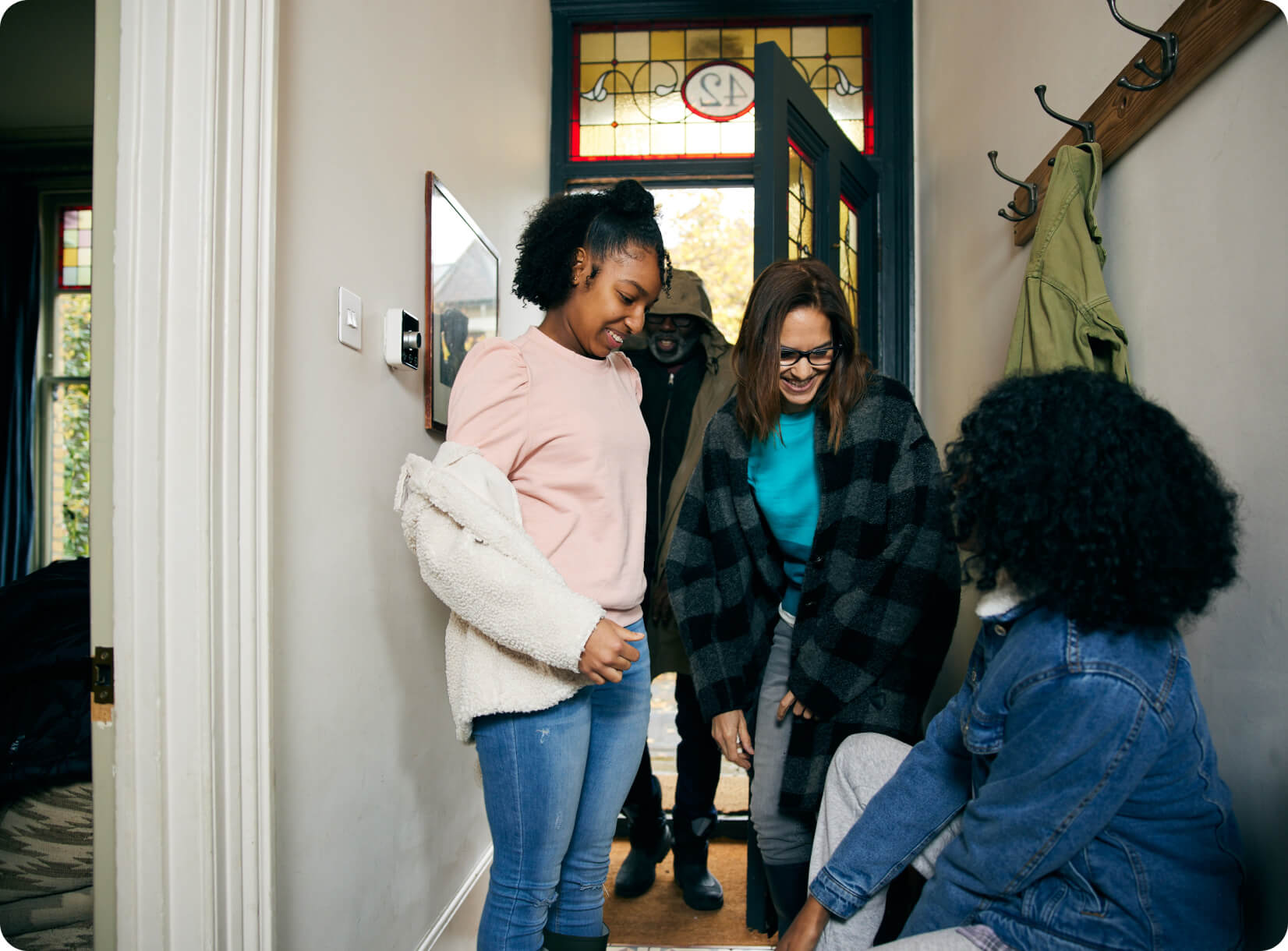 A family in the hallway of their smart home.