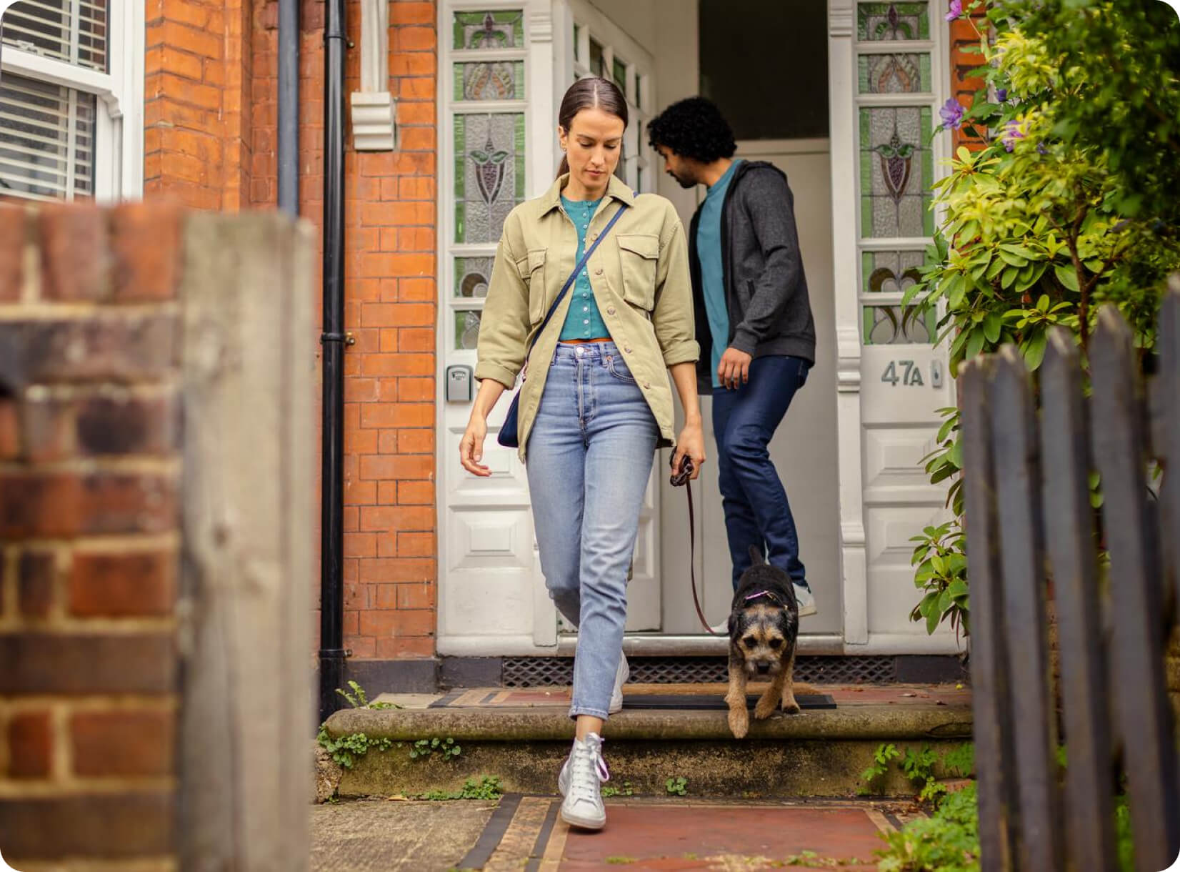 Hive Home customers walking out of their front door.